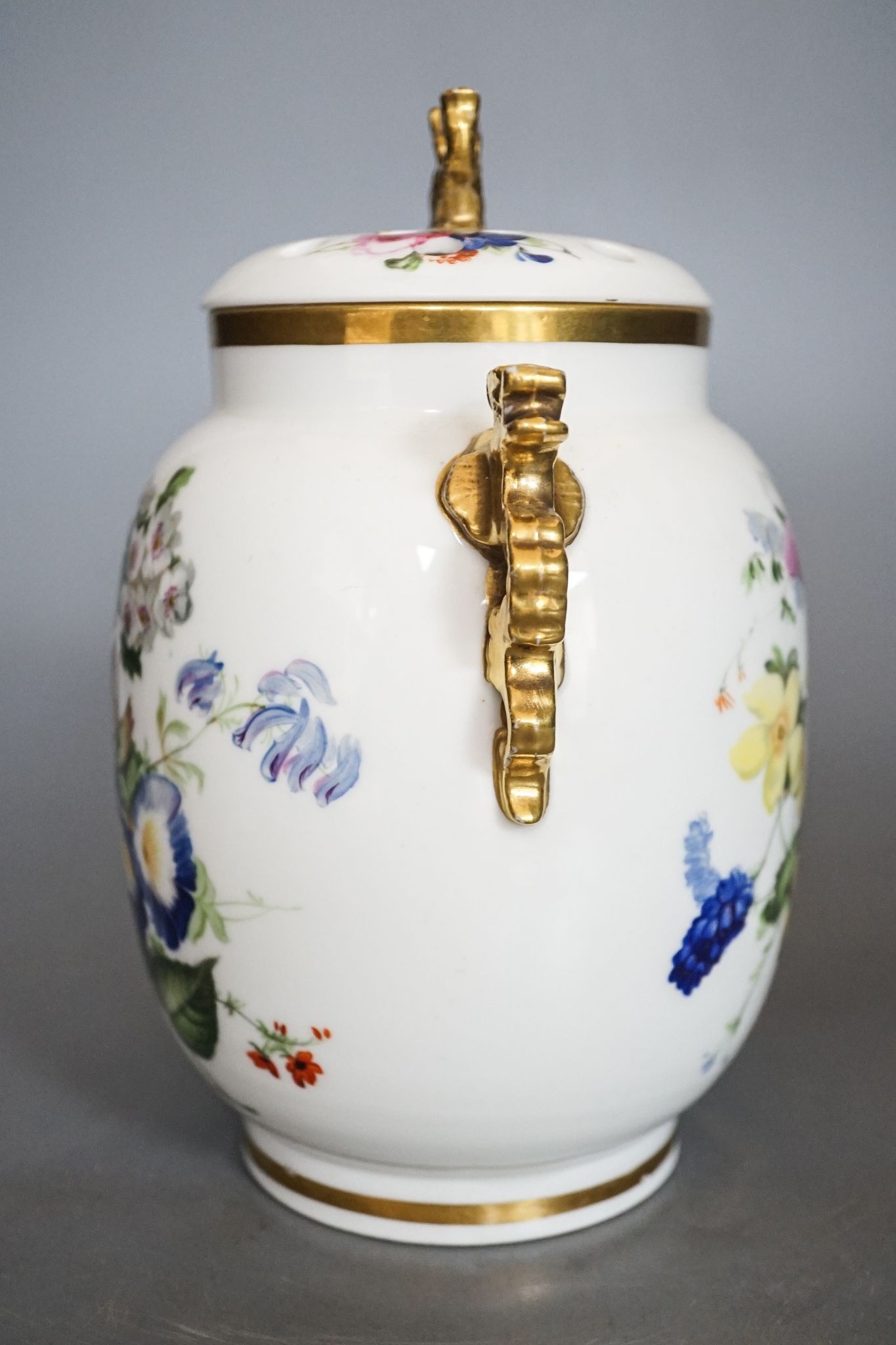 An English porcelain pot pourri vase, cover and inner cover, probably Coalport, painted with roses and flowers 21cm